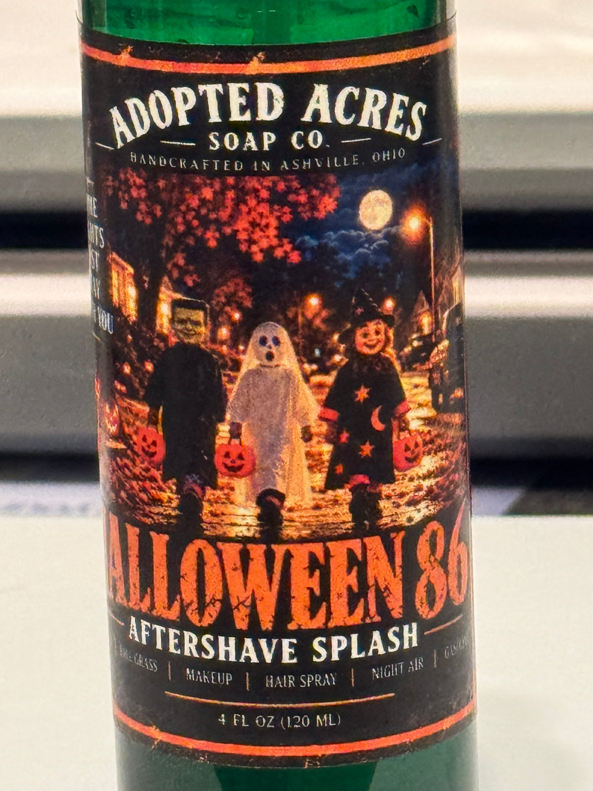 Adopted Acres Halloween 86 aftershave splash with its label